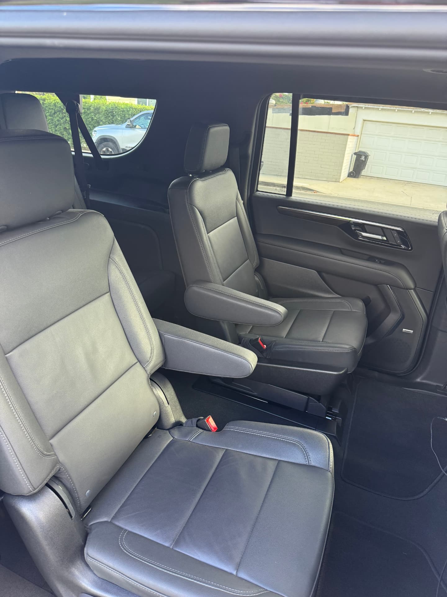 Captain's chairs in the second row of the black Suburban VIP SUV