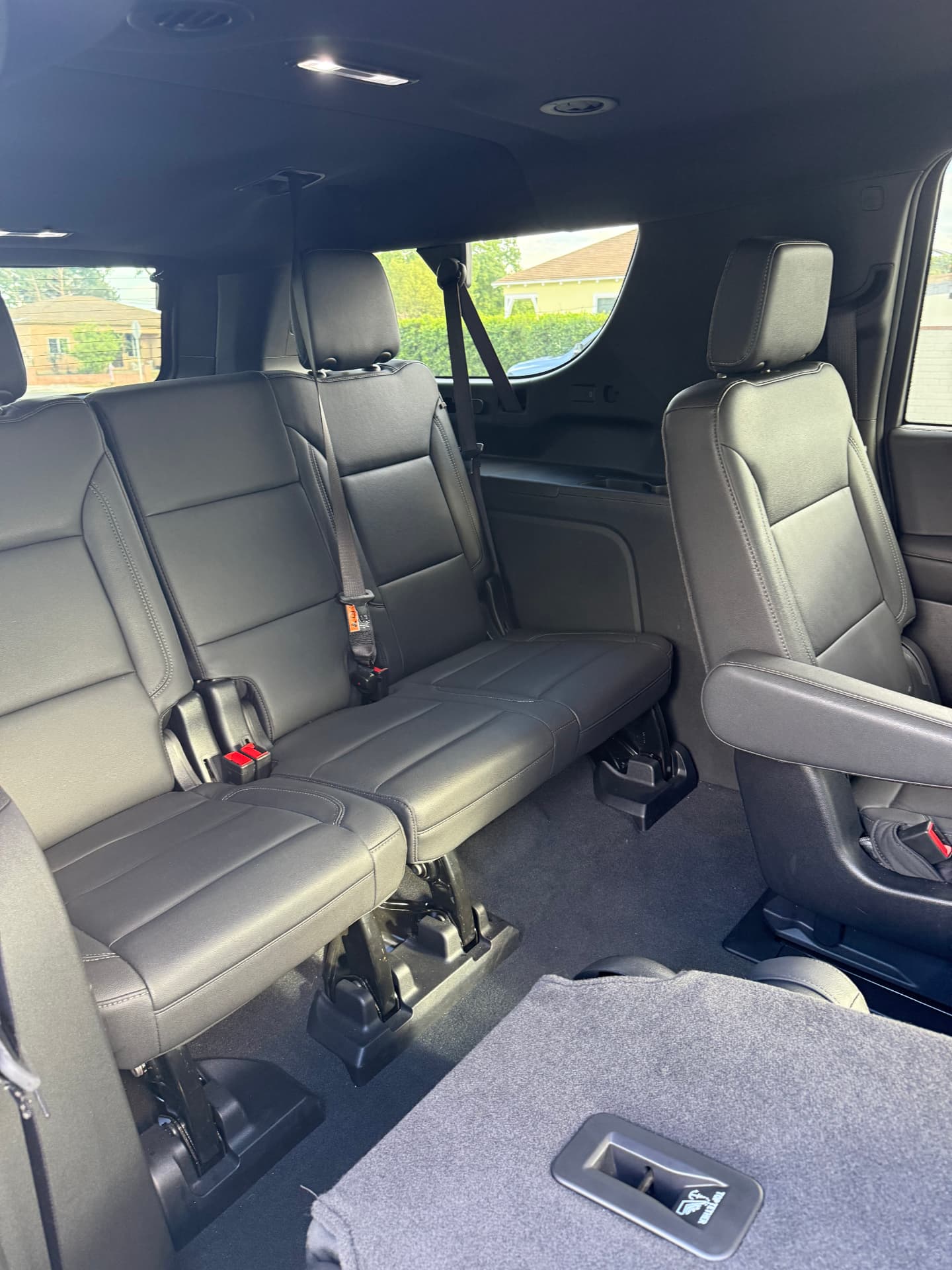 Third-row leather seating inside the Suburban VIP SUV